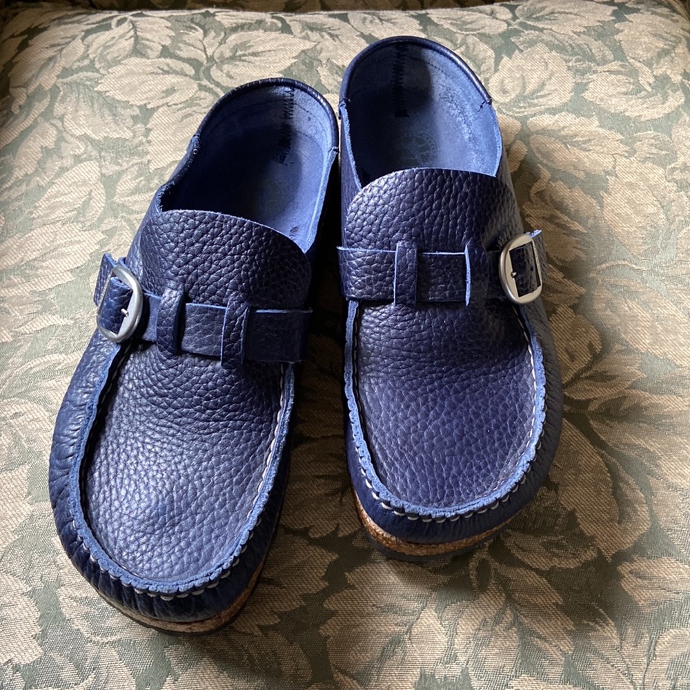 The BIRKENSTOCK Buckley, semi-open moccasin-style clog in textured leather.